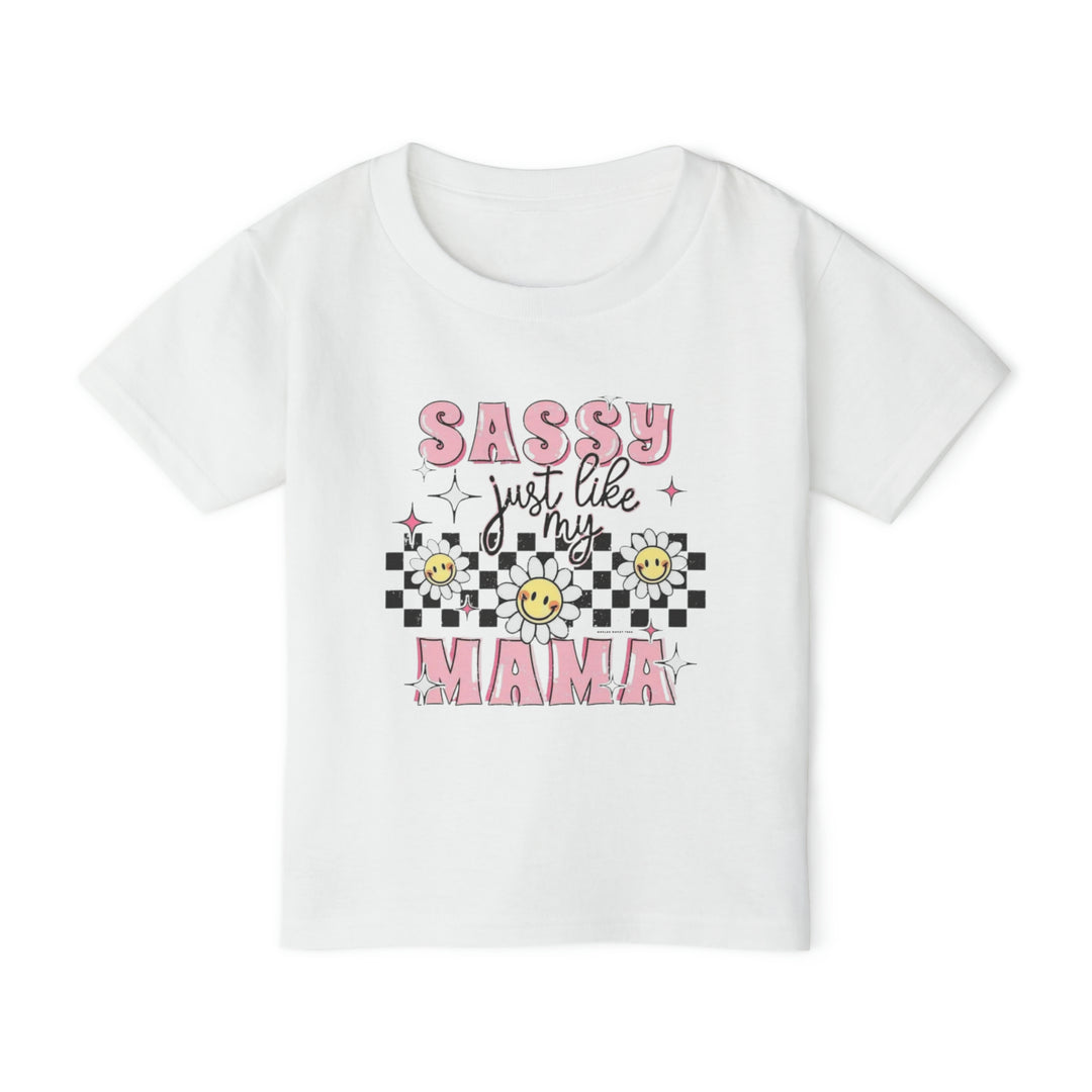 Toddler tee with pink and black text, floral accents, and a smiley face. Made of 100% cotton for softness and comfort. Classic fit with rib collar. Sassy Just Like My Mama Toddler Tee.