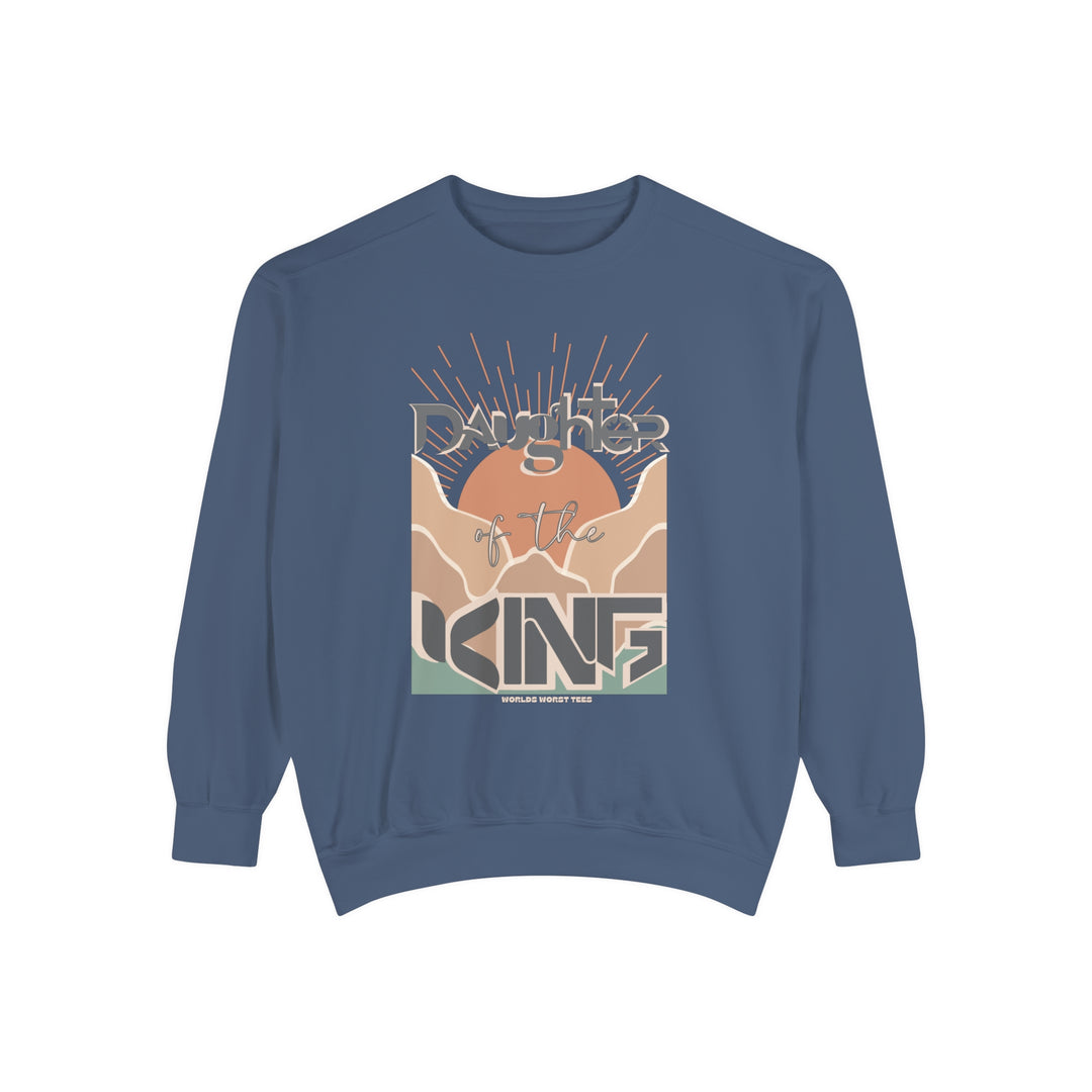 Daughter of the King Crew unisex sweatshirt in blue with graphic design. Luxurious 80% ring-spun cotton, 20% polyester fabric, relaxed fit, rolled-forward shoulder, and back neck patch. From Worlds Worst Tees.