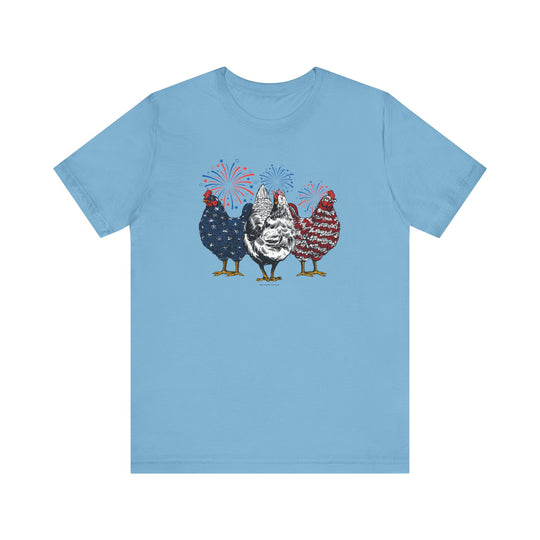 A blue t-shirt featuring chickens and fireworks, part of the Chicken 4th Tee collection by Worlds Worst Tees. Unisex jersey tee made of 100% cotton, with ribbed knit collars and tear-away label. Sizes XS to 3XL.