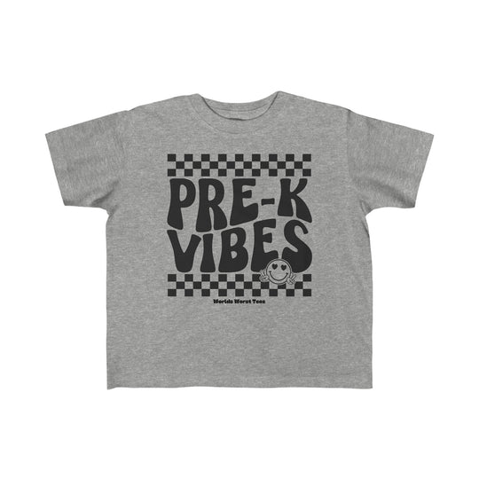 Pre K Vibes Toddler Tee featuring black text on grey fabric. Soft 100% combed ringspun cotton, light 4.5 oz fabric, tear-away label. Perfect for sensitive skin, durable for little adventures. Classic fit.