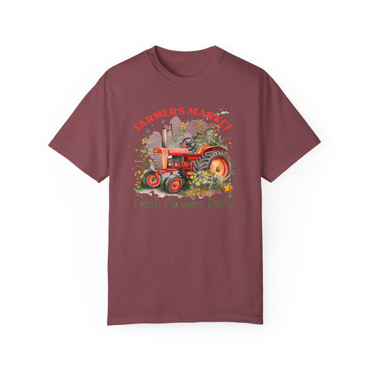 Alt text: Fresh Flowers Tee: A red shirt featuring a tractor and flowers, crafted from 100% ring-spun cotton with a relaxed fit and durable double-needle stitching, embodying comfort and style from Worlds Worst Tees.