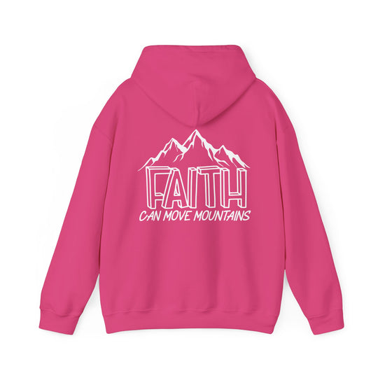 A pink hoodie with white text featuring Faith Can Move Mountains, a cozy blend of cotton and polyester, ideal for chilly days. Kangaroo pocket and matching drawstring for style and practicality.