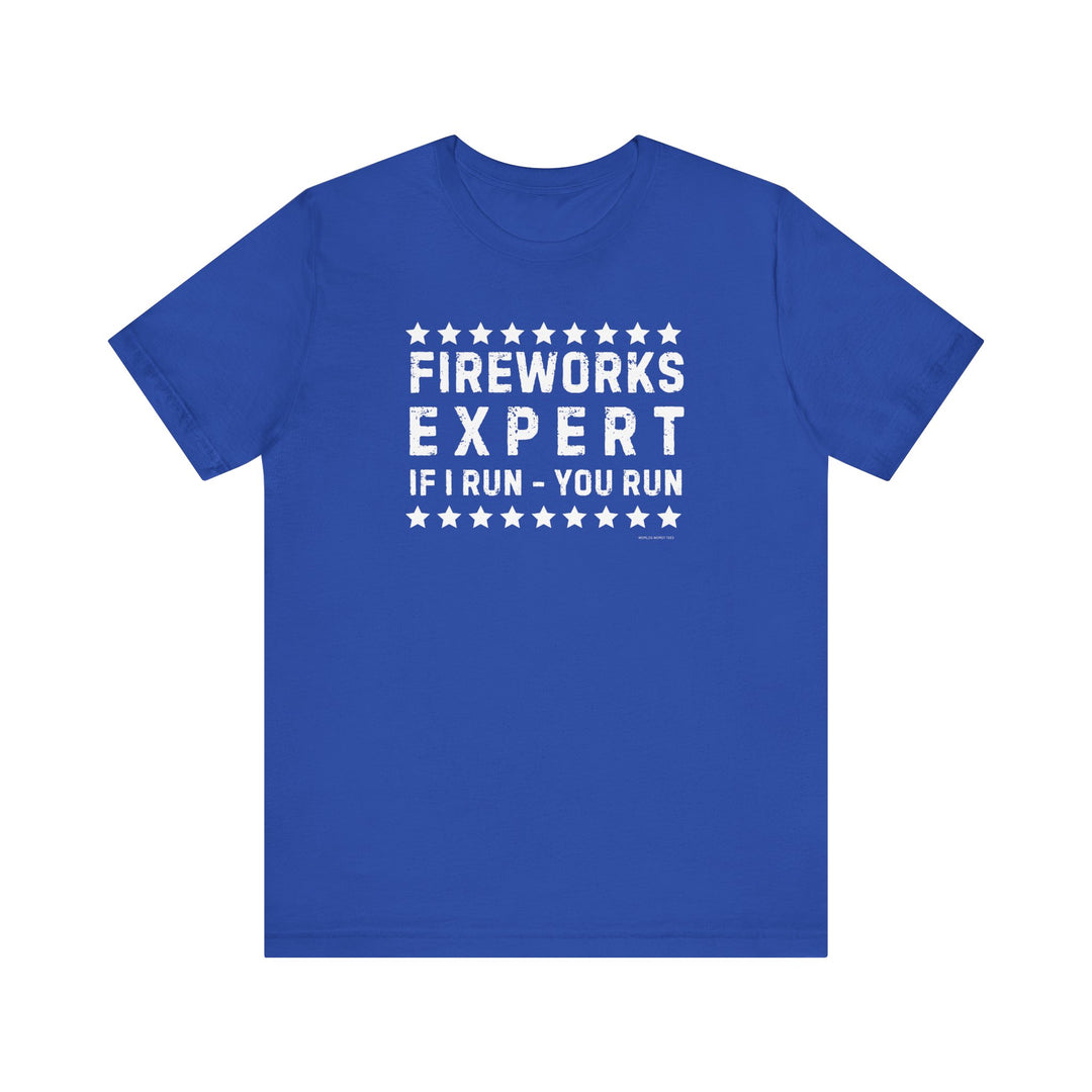 Firework Expert Tee: Unisex jersey shirt with white text on blue fabric. 100% Airlume combed cotton, ribbed knit collars, tear away label. Retail fit, true to size. Ideal for casual wear.