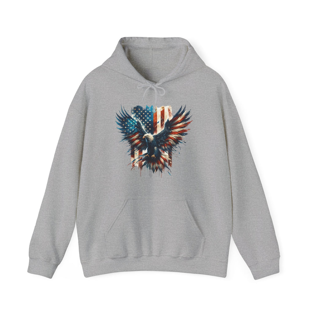 A grey American Eagle Hoodie sweatshirt with a patriotic design featuring an eagle and flag. Unisex heavy blend, cotton-polyester fabric, kangaroo pocket, and drawstring hood. Medium-heavy fabric, tear-away label, classic fit.