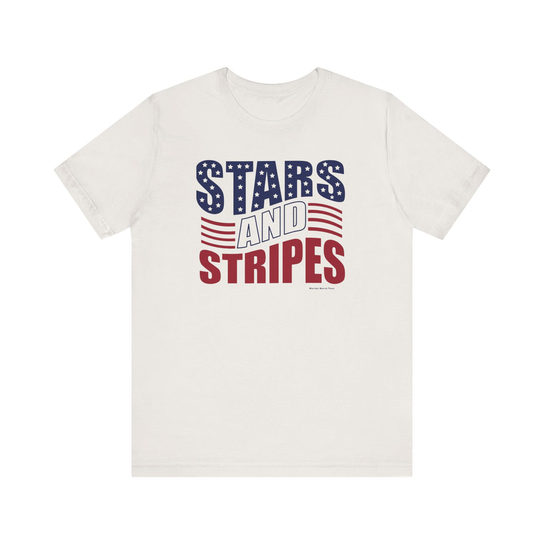 A white Stars and Stripes Tee, featuring red and blue text and a logo. Unisex jersey tee with ribbed knit collars, taping on shoulders, and dual side seams for durability. 100% Airlume combed and ringspun cotton.