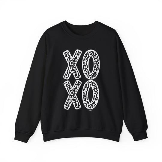 A unisex heavy blend crewneck sweatshirt featuring a black and white XOXO Crew design. Made of 50% cotton and 50% polyester, with ribbed knit collar and no itchy side seams. Medium-heavy fabric, loose fit, and sewn-in label.