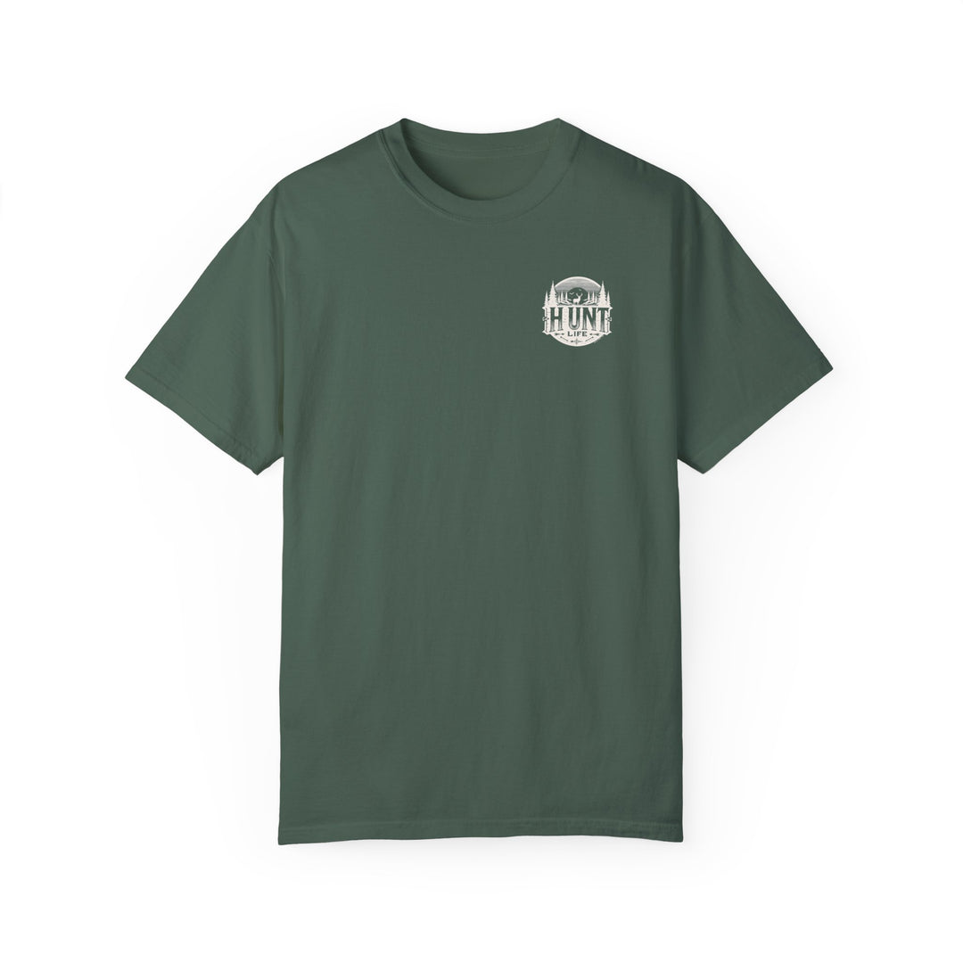 A green Raise Um Right Tee, featuring a deer and trees logo on ring-spun cotton. Garment-dyed for coziness, with double-needle stitching for durability and a relaxed fit for daily wear.