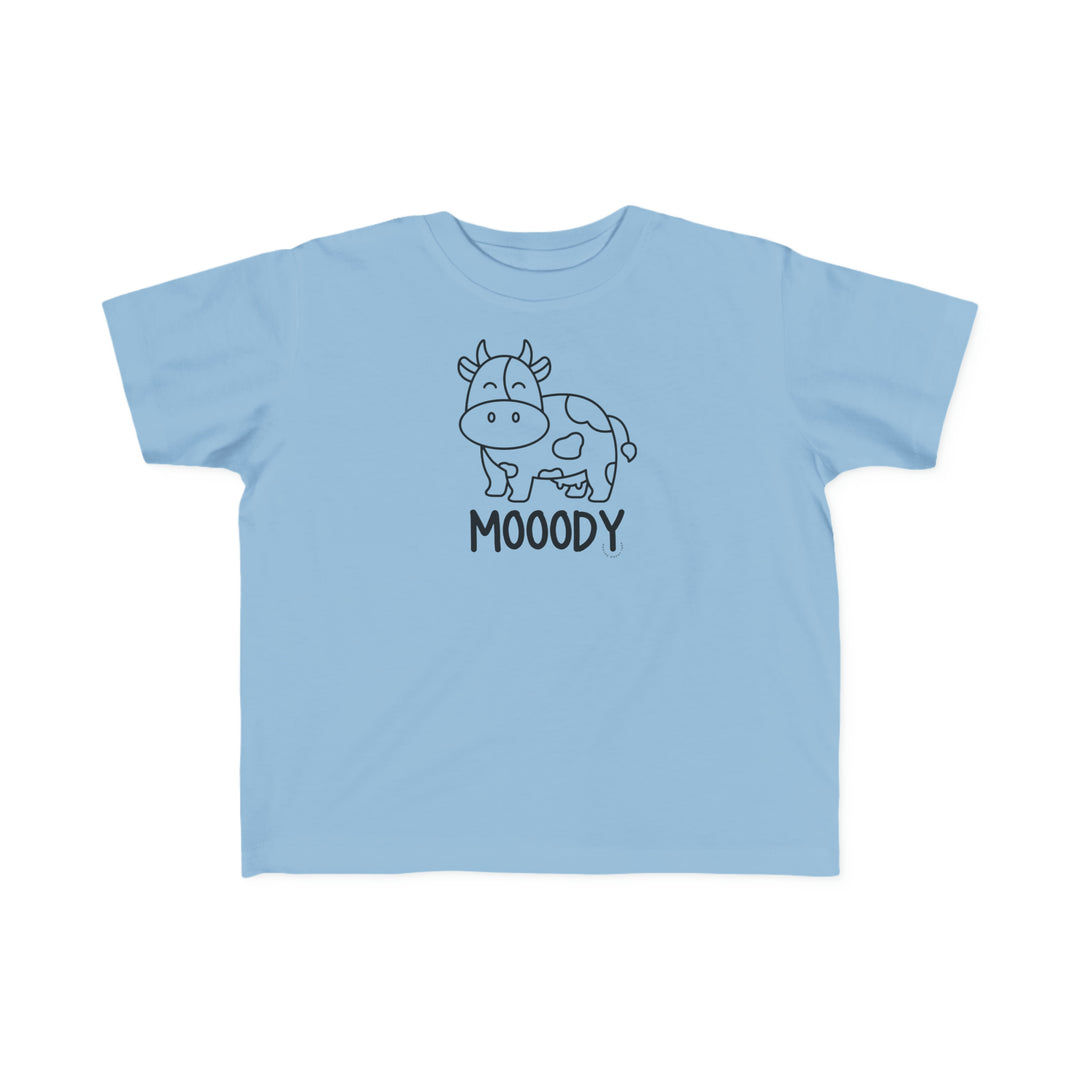 Moody Toddler Tee: A blue shirt featuring a cow drawing, perfect for sensitive toddler skin. Made of 100% combed ringspun cotton, light fabric, classic fit, tear-away label, and true-to-size.