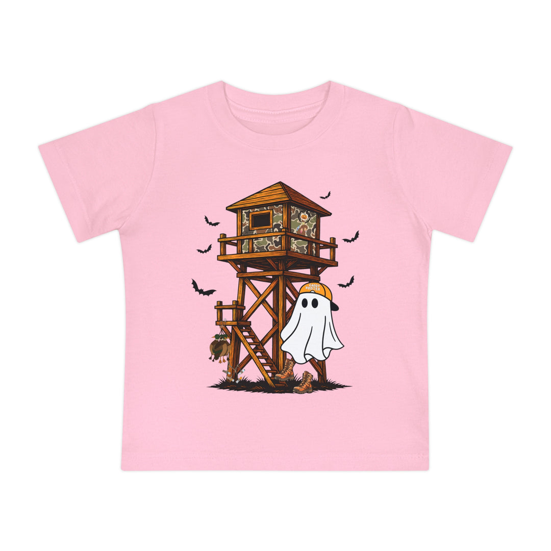 Ghost Hunter Baby Tee featuring a whimsical Halloween-hunting scene with a camouflaged blind, bats, turkey, and a cartoon ghost in hunter gear.