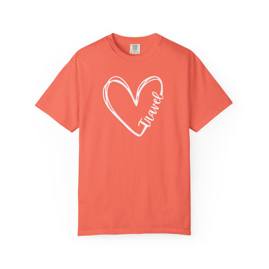 Coral-colored Travel Tee featuring a hand-drawn heart outline and Travel script, showcasing comfort and durability with a relaxed fit, perfect for everyday wear.