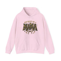 Light-pink pullover hoodie with GOD MADE ME A MAMA slogan, camouflage MAMA, decorative stars, foliage, and bow; features kangaroo pocket and drawstring hood.