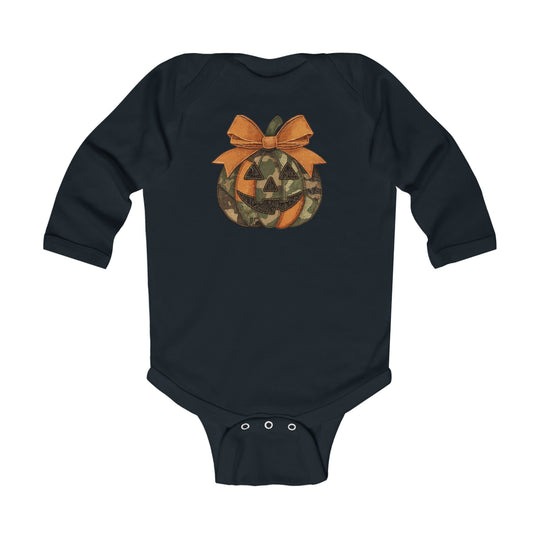 Jackie O Long Sleeve Onesie features a camo jack-o’-lantern with an orange bow on a dark bodysuit, offering comfort with durable ribbed bindings and easy-snap closures.