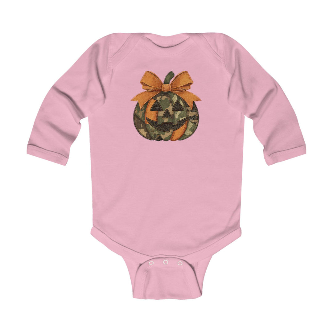 Jackie O Long Sleeve Onesie, featuring a camouflage jack-o-lantern graphic and orange bow, with snap closures for easy changing, designed for durability and comfort.