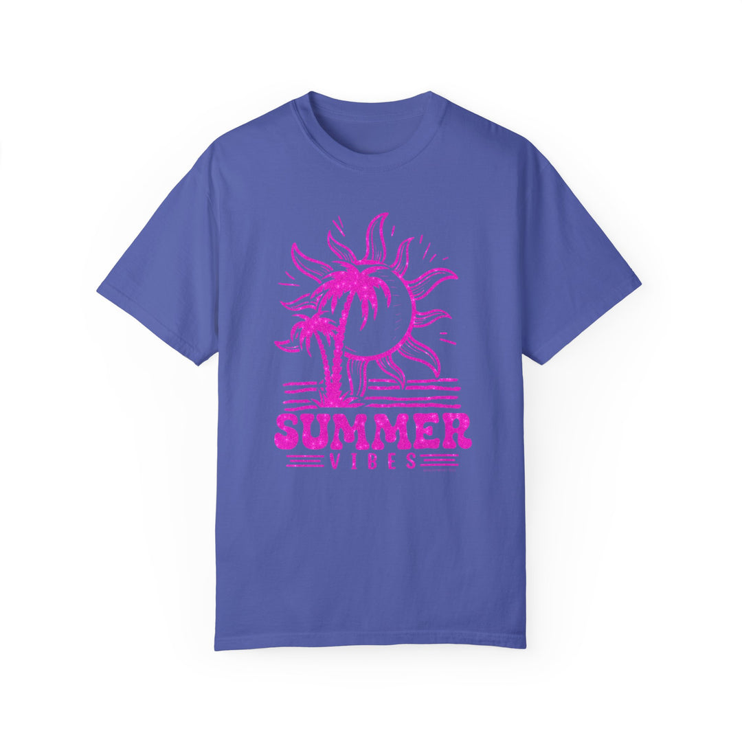 Summer Vibes Tee: Blue shirt with pink sun, palm trees, and glittery accents. 100% ring-spun cotton, medium weight, relaxed fit, durable double-needle stitching, seamless design for comfort. From Worlds Worst Tees.