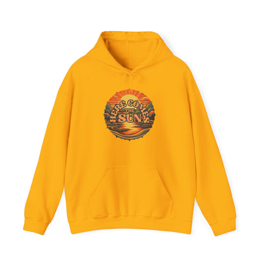 A yellow Here Comes the Sun Hoodie, a cozy blend of cotton and polyester with a kangaroo pocket and drawstring hood. Unisex sizing available from S to 5XL. Ideal for a relaxed, warm vibe.