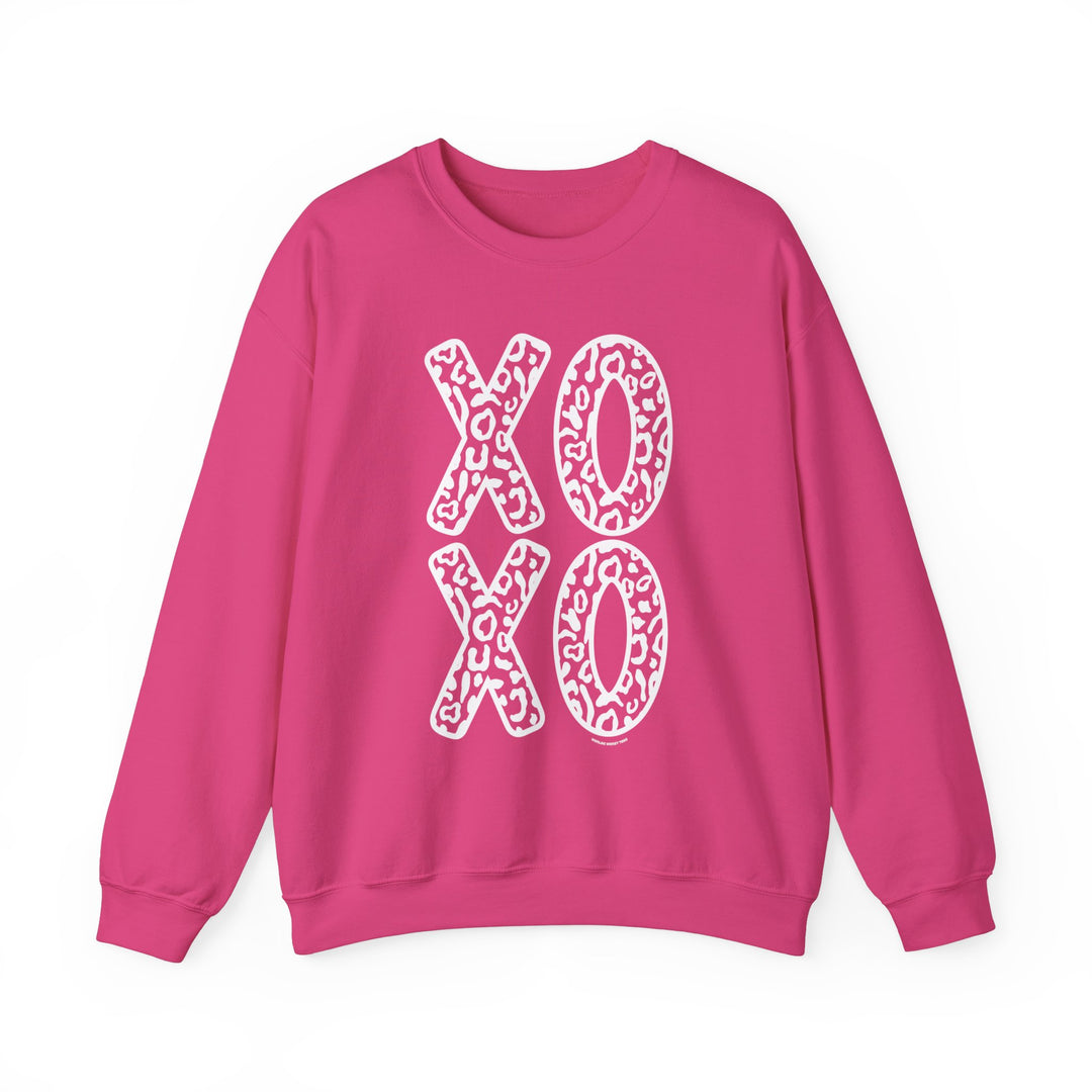 A unisex heavy blend crewneck sweatshirt featuring XOXO Crew design. 50% cotton, 50% polyester, medium-heavy fabric, loose fit, ribbed knit collar, no itchy side seams. Ideal for comfort in any situation.