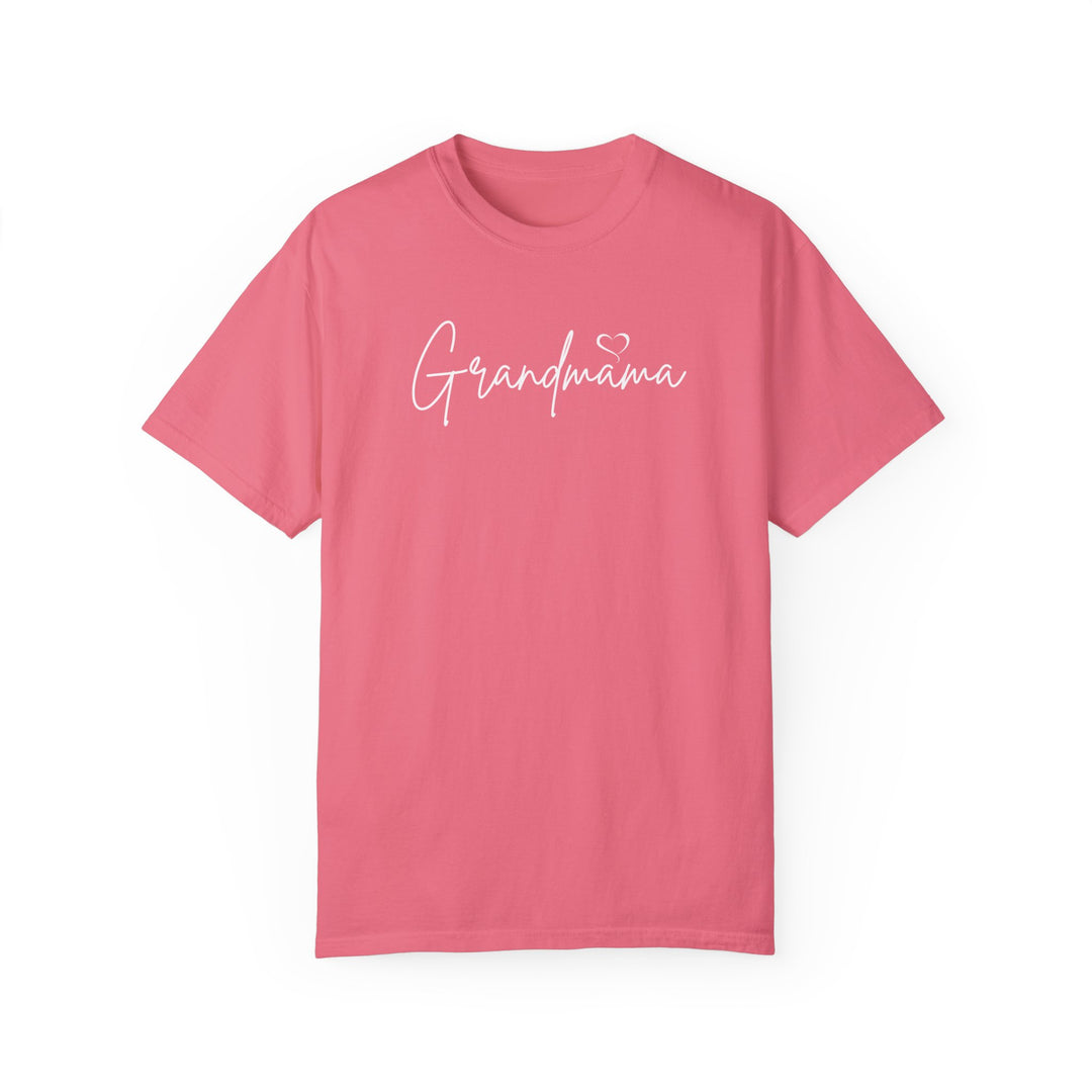 Grandmama Tee: A pink shirt with white text, made of 100% ring-spun cotton. Features a relaxed fit, double-needle stitching, and no side-seams for durability and comfort. Ideal for daily wear.