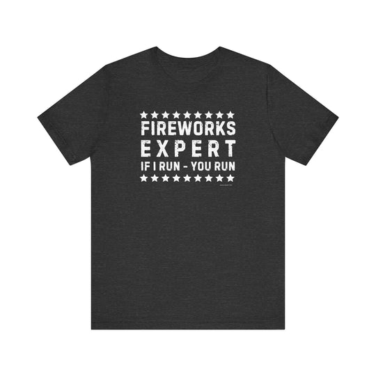 A black Firework Expert Tee with white text, a classic unisex jersey short sleeve tee made of 100% Airlume combed and ringspun cotton. Features ribbed knit collars, taping on shoulders, and tear away label.
