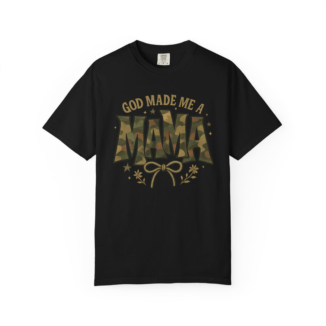 Black short-sleeved God Made Me a Mama Tee with gold lettering and camouflage MAMA graphic, featuring bow, floral sprigs, and stars.