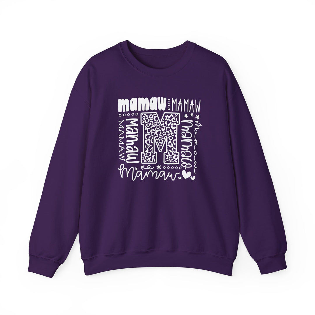 A cozy Mamaw Crew unisex sweatshirt in purple with white letters. Made of 50% cotton and 50% polyester, featuring a ribbed knit collar and double-needle stitching for durability. Ideal for colder months.