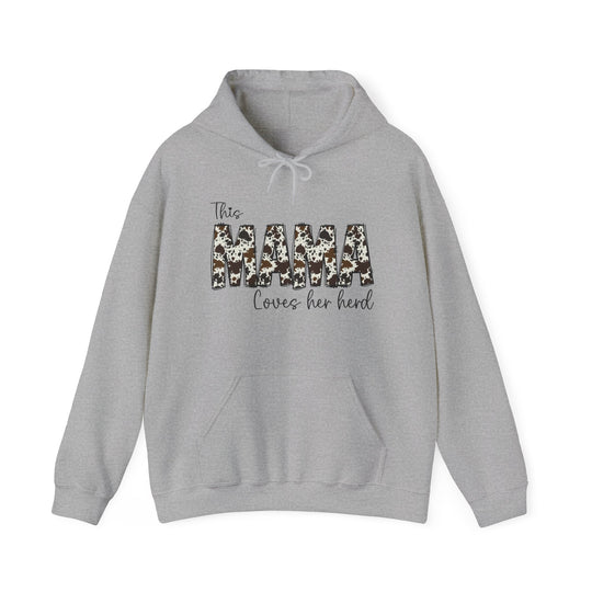 A Mama Herd Hoodie, a cozy blend of cotton and polyester, featuring a kangaroo pocket and drawstring hood. Classic fit, tear-away label, ideal for printing. Unisex sizing from S to 5XL.
