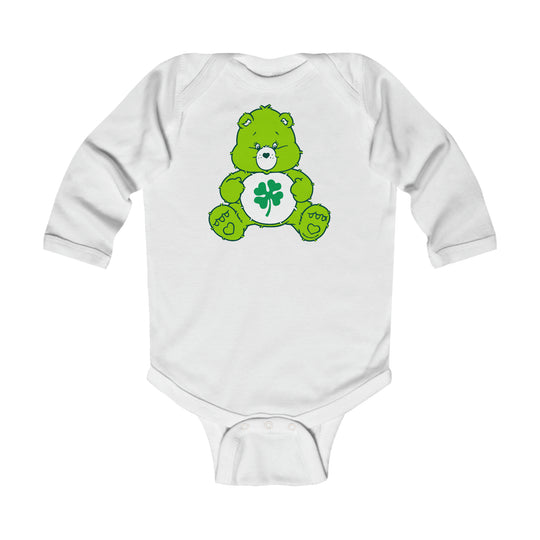 A Lucky Bear Onesie for infants, featuring a white bodysuit with a green bear design. Made of soft, durable 100% cotton with plastic snaps for easy changing. Ideal for comfort and style.
