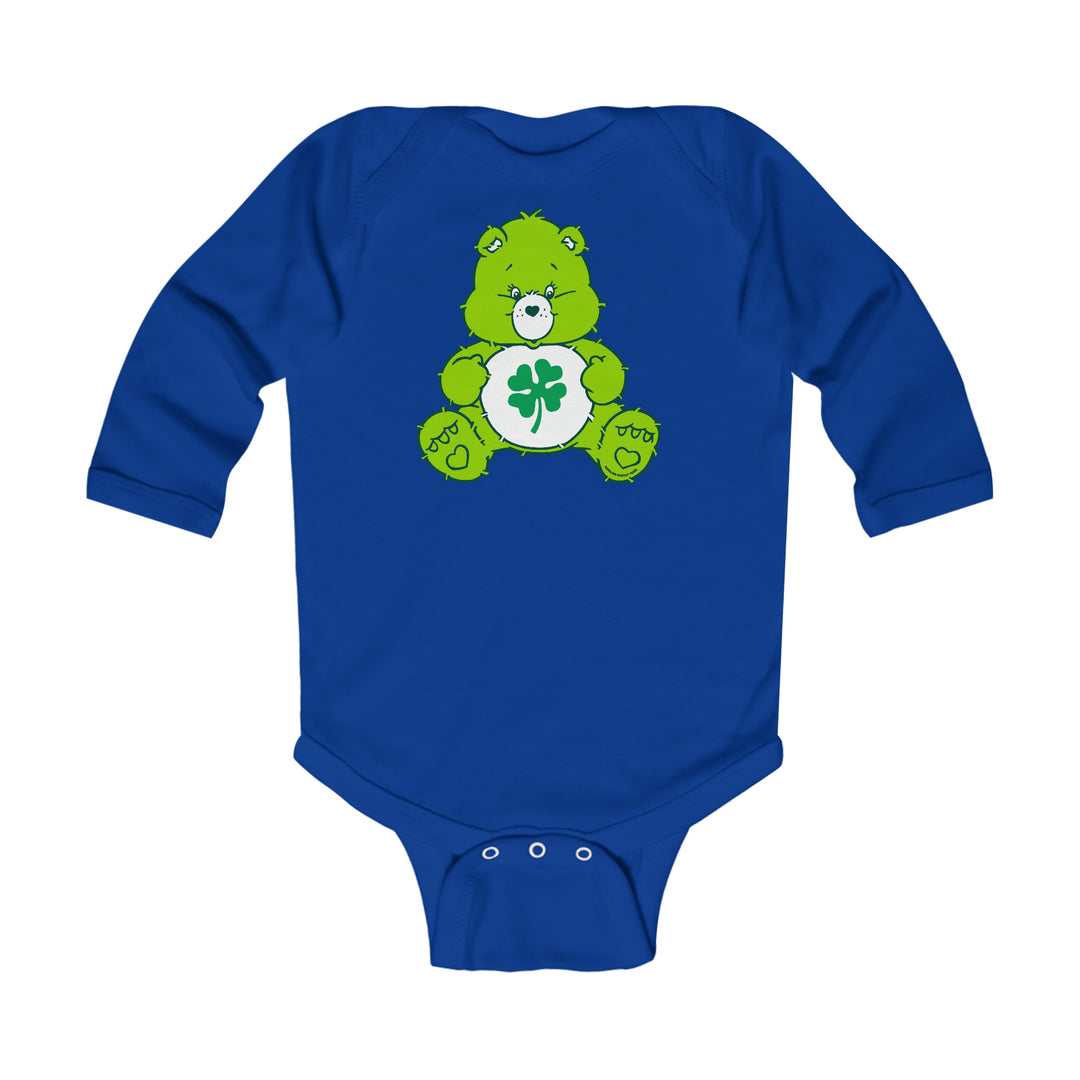 A Lucky Bear Onesie for infants, featuring a green bear design on a blue bodysuit. Made of soft, durable cotton with plastic snaps for easy changing. Ideal for comfort and style.
