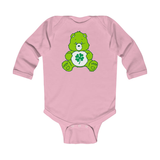 Infant Lucky Bear Onesie: Pink bodysuit with green bear design. Soft, durable 100% cotton fabric. Plastic snaps for easy changing. Perfect for babies 0-18M.