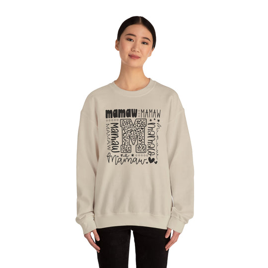 A Mamaw Crew unisex heavy blend crewneck sweatshirt in a classic fit, made of 50% cotton and 50% polyester fabric. Ribbed knit collar, double-needle stitching, tear-away label, and ethically grown US cotton.