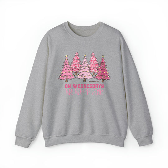 Unisex heavy blend crewneck sweatshirt featuring a pink Christmas tree design. Ribbed knit collar, no itchy side seams. 50% cotton, 50% polyester, loose fit. Sewn-in label. True to size.
