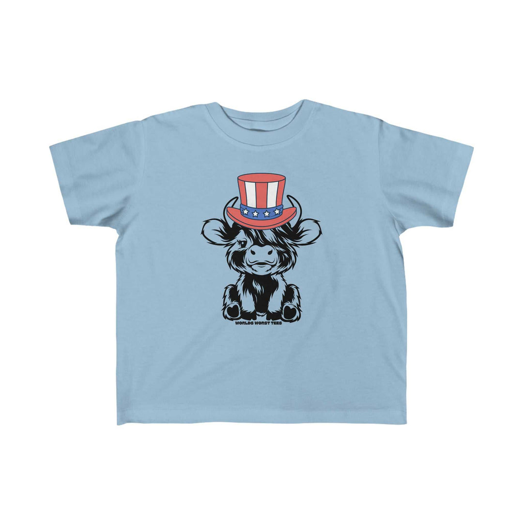 A toddler tee featuring a cartoon cow in a hat, ideal for sensitive skin. Made of 100% combed ringspun cotton, light fabric, classic fit, tear-away label, and true-to-size. Product title: 4th of July Family Cowboy Toddler Tee.