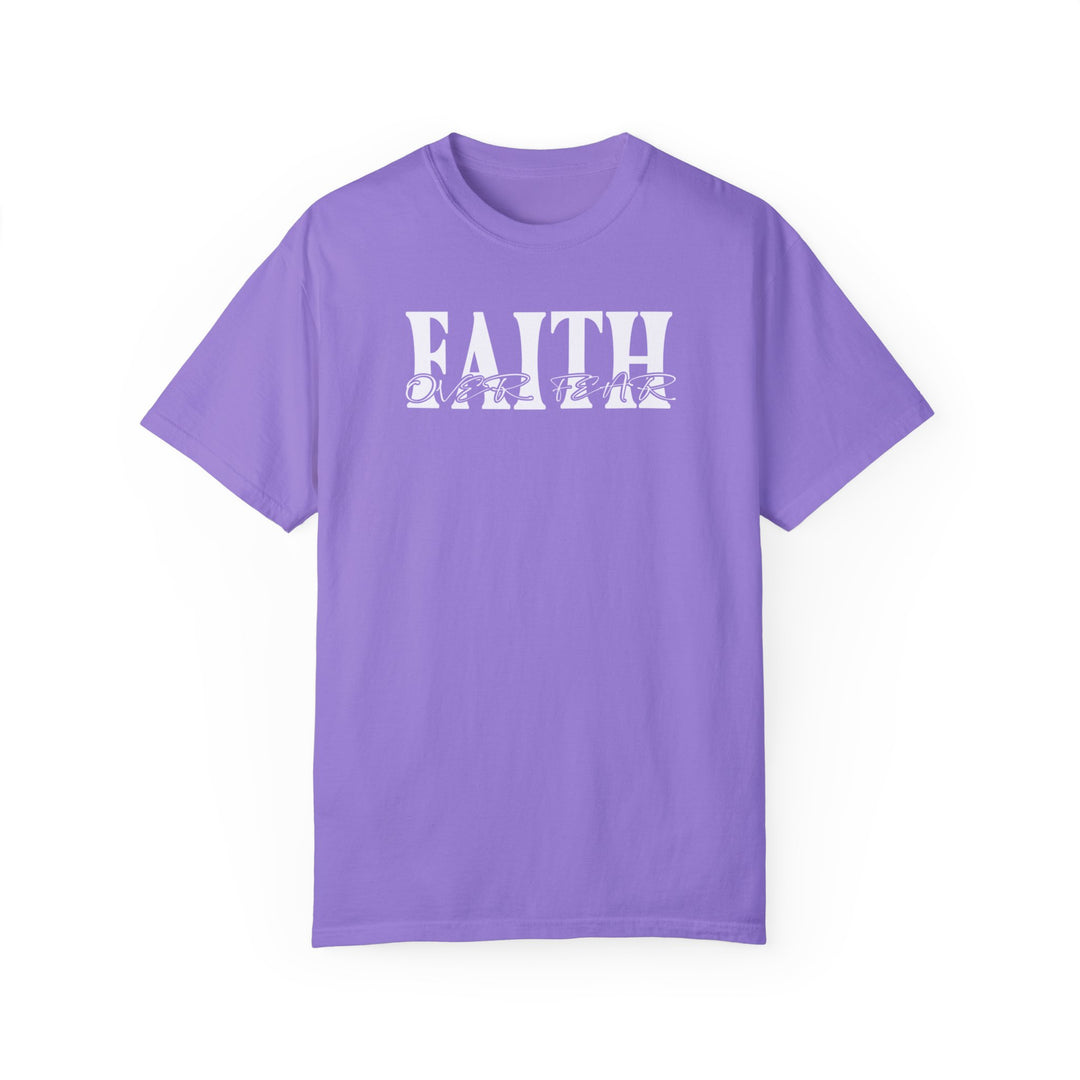 A ring-spun cotton Faith Over Fear Tee in purple with white text. Garment-dyed for coziness, featuring a relaxed fit, double-needle stitching, and no side-seams for durability and shape retention.