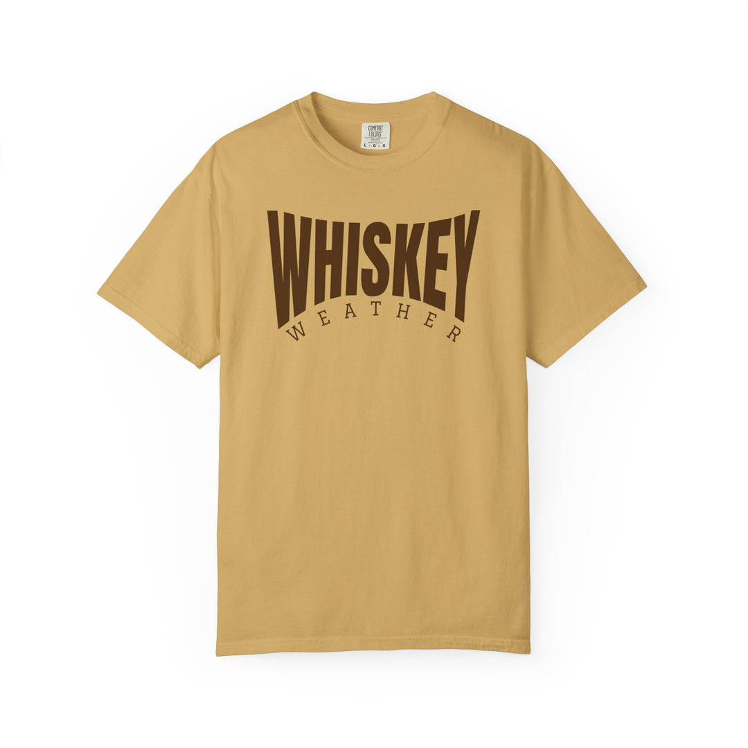Whiskey Weather Tee: Mustard short-sleeve crew-neck with WHISKEY WEATHER in dark brown, offering a relaxed fit and durable design for everyday comfort.