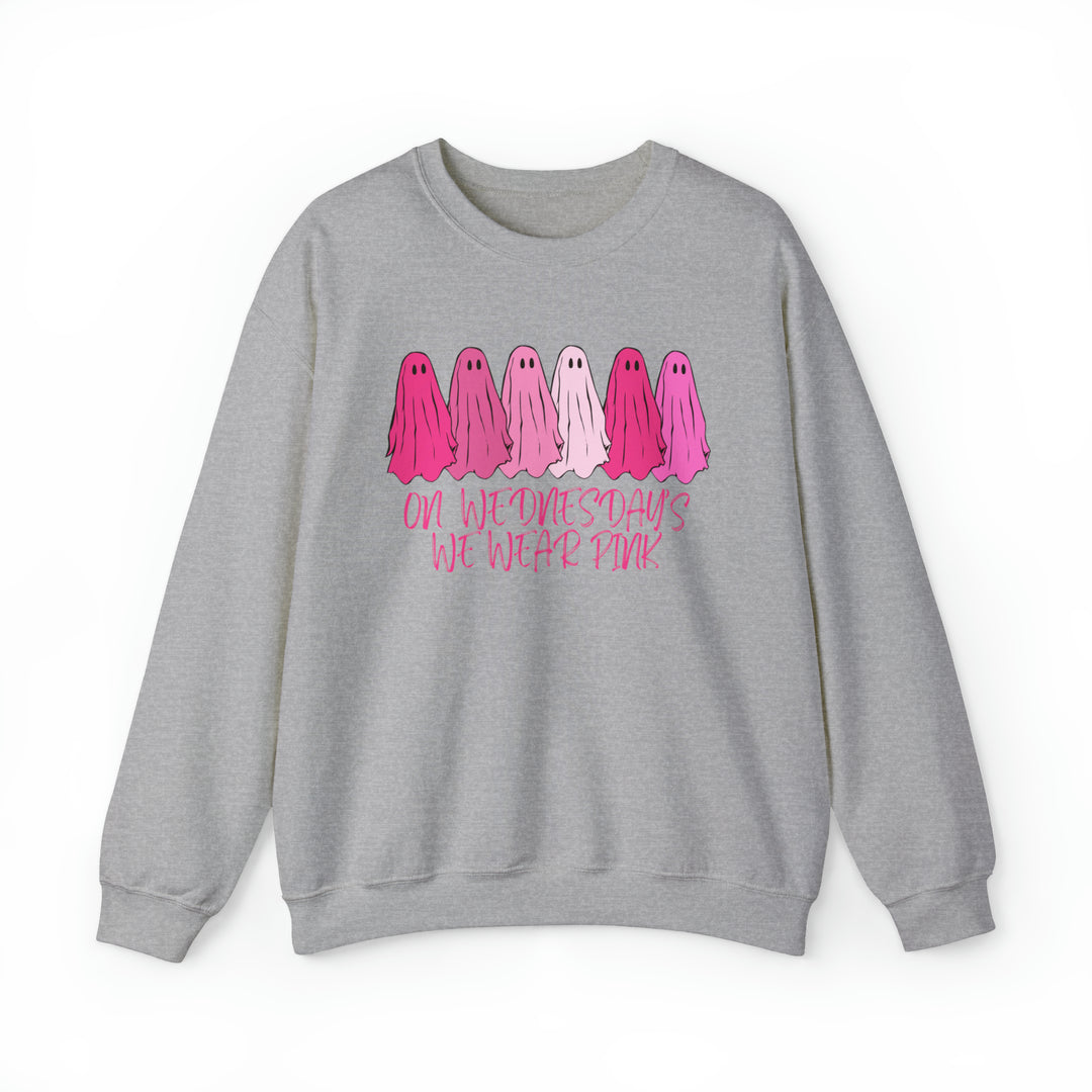 A comfortable unisex heavy blend crewneck sweatshirt featuring a pink and white On Wednesday's We Wear Pink design. Made of 50% cotton and 50% polyester, with ribbed knit collar and no itchy side seams.