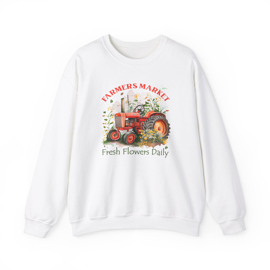 A white crewneck sweatshirt featuring a tractor design, ideal for comfort in any situation. Made of 50% cotton and 50% polyester, with ribbed knit collar for shape retention. Unisex, medium-heavy fabric with a loose fit.
