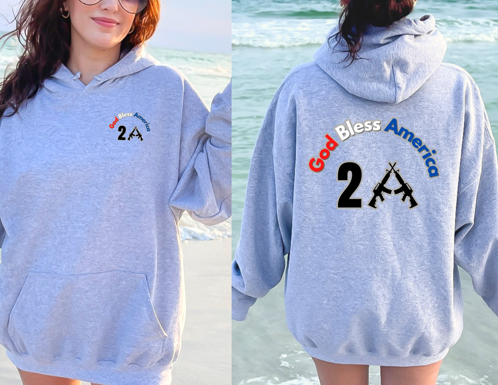 A unisex heavy blend God Bless America 2A hoodie in grey, featuring a logo on the front. Thick cotton-polyester fabric, kangaroo pocket, and drawstring hood. Medium-heavy, classic fit, tear-away label.