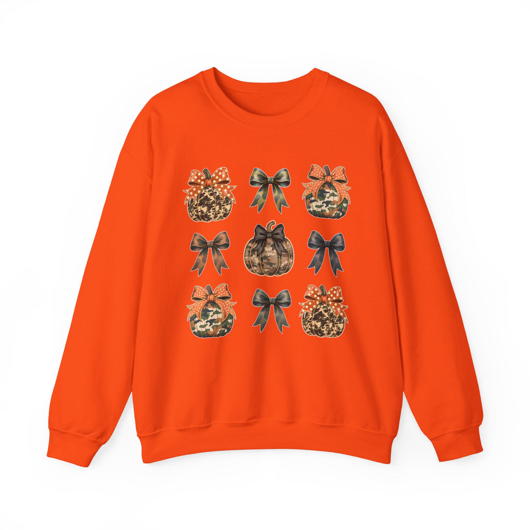 Bright-orange crewneck sweatshirt featuring a 3x3 grid of camo and animal-print pumpkins and bows, perfect for Halloween or harvest season. Comfortable, durable, and ideal for colder months.