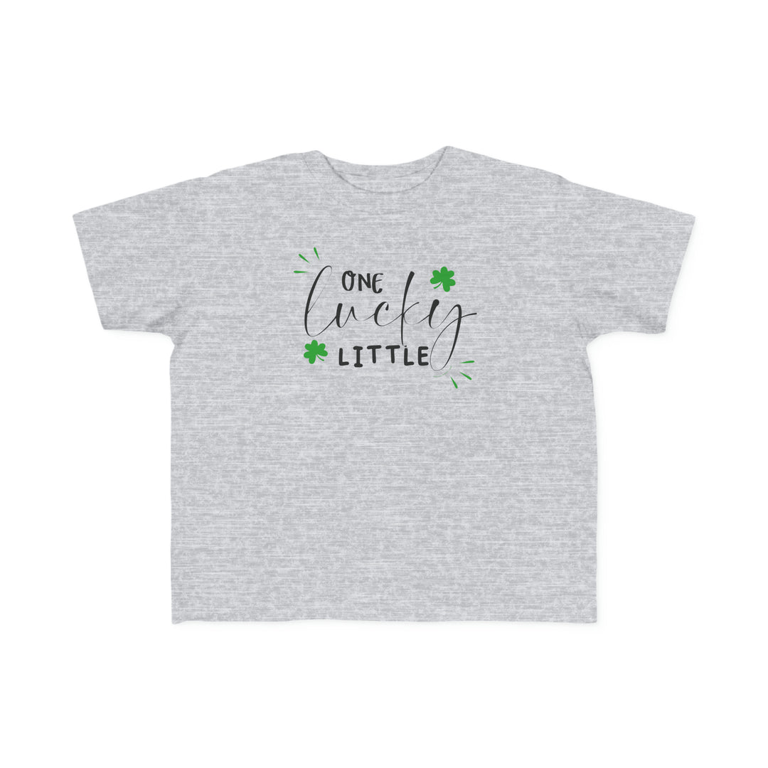 A toddler's classic fit tee, One Lucky Little Tee, featuring green shamrocks and text. Soft 100% cotton, tear-away label, perfect for sensitive skin. Sizes: 2T, 3T, 4T, 5-6T.