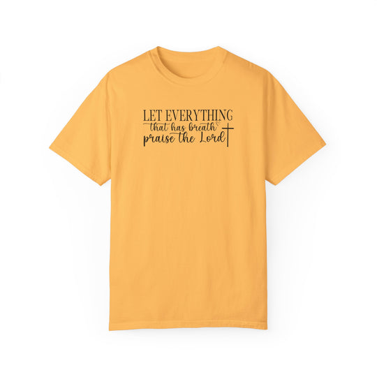 Relaxed fit Let Everything That Has Breath Praise the Lord Tee, a yellow t-shirt with black text. 100% ring-spun cotton, garment-dyed for coziness. Durable double-needle stitching, seamless design for comfort.