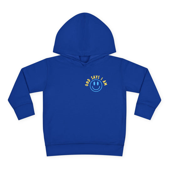 I AM Toddler Hoodie features a royal blue pullover with a smiley-face graphic, yellow God says I am text, and ribbed cuffs for comfort.