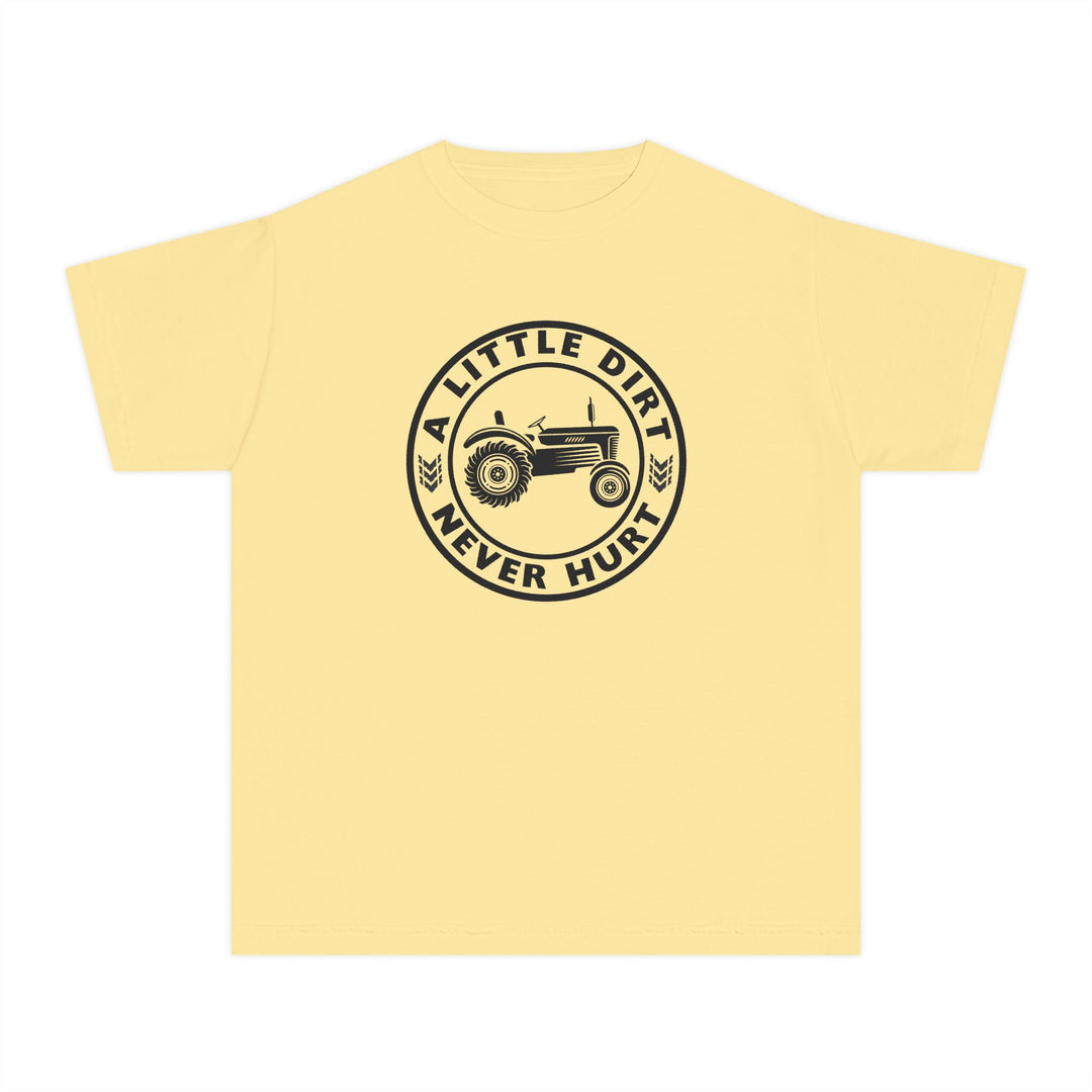 Pale yellow kids' T-shirt featuring a black circular badge with an old-style farm tractor, text A LITTLE DIRT NEVER HURT, and wheat icons.
