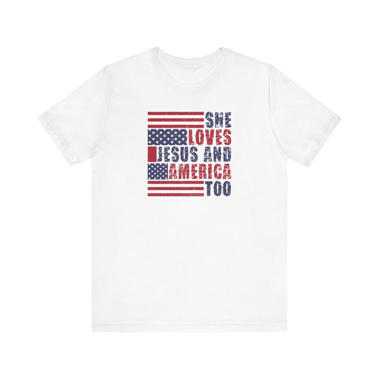 A She Loves Jesus and America Tee: A white unisex jersey t-shirt with red and blue text. 100% Airlume combed cotton, retail fit, tear away label. Soft fabric, ribbed knit collars, taping on shoulders, dual side seams. Sizes XS to 3XL.