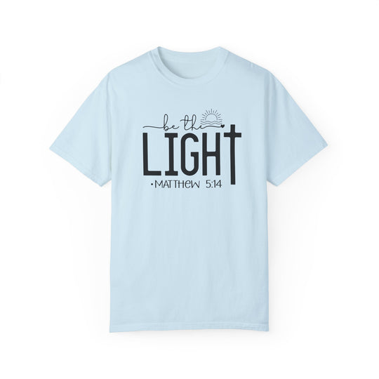 A light blue Be the Light Tee, 100% ring-spun cotton, garment-dyed for coziness. Relaxed fit, double-needle stitching, no side-seams for durability and shape retention.