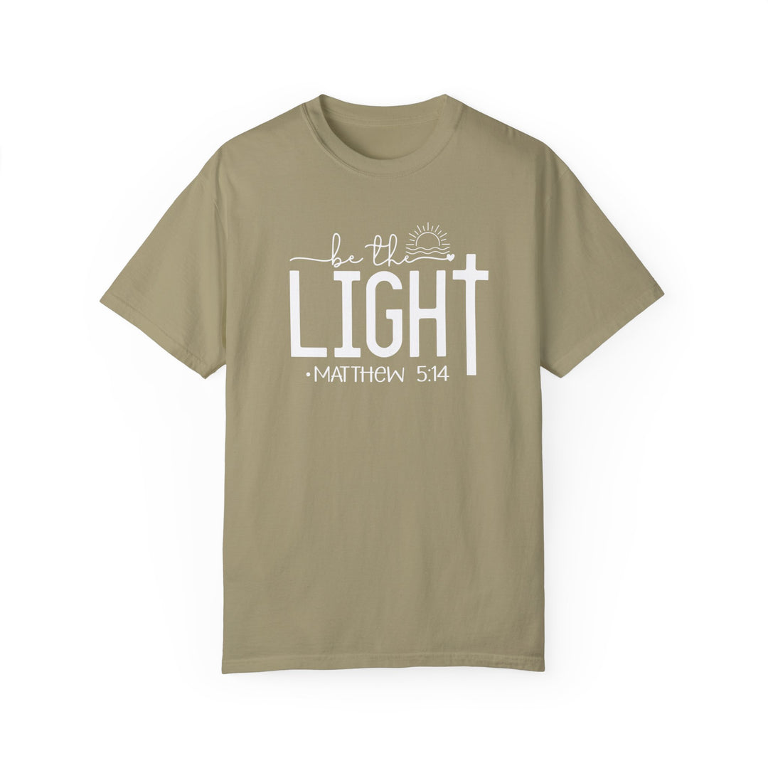 A tan Be the Light Tee, 100% ring-spun cotton, medium weight, relaxed fit, double-needle stitching, no side-seams for durability and shape retention.