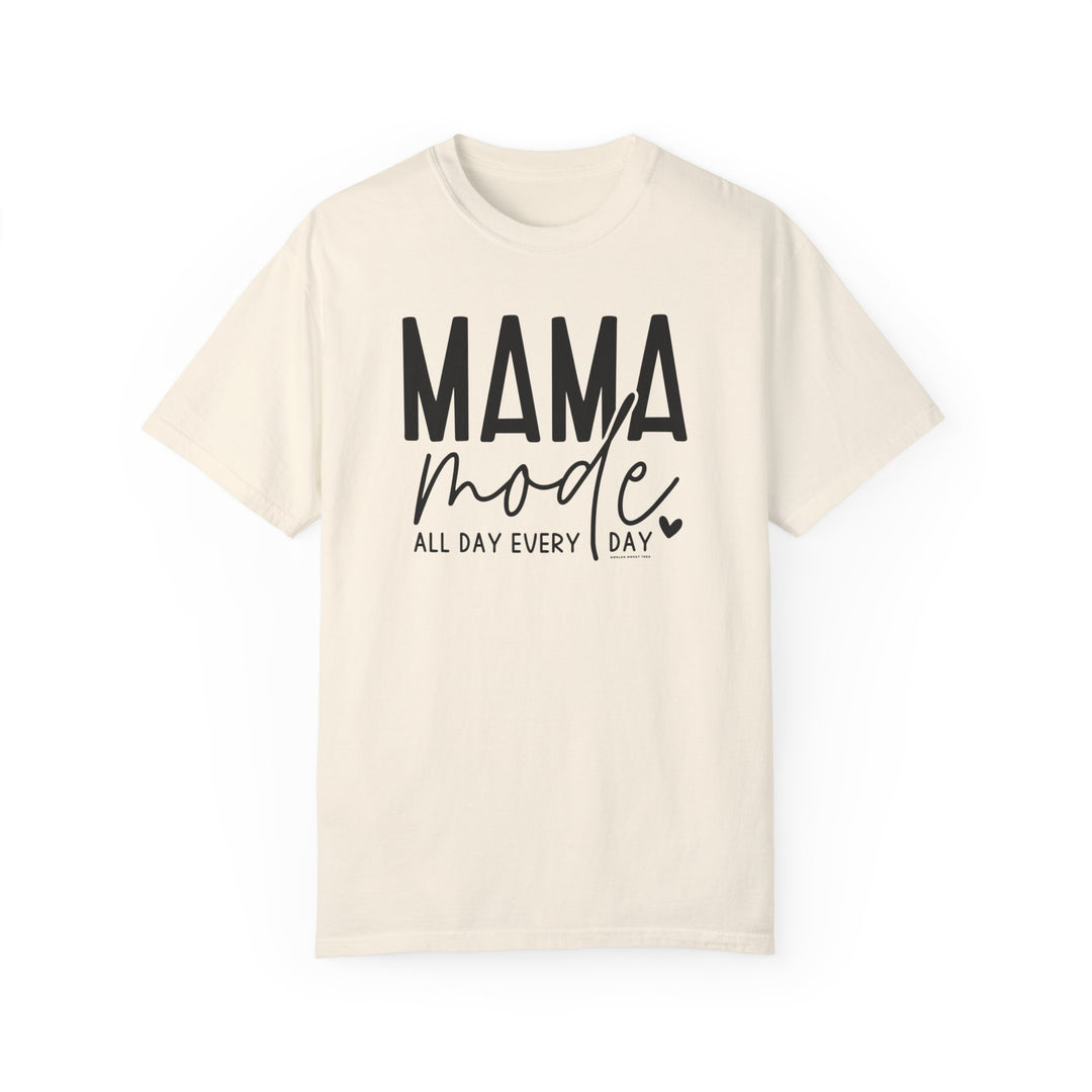 A white Mama Mode Tee with black text, made of 100% ring-spun cotton. Garment-dyed for extra coziness, featuring a relaxed fit and durable double-needle stitching. From Worlds Worst Tees.