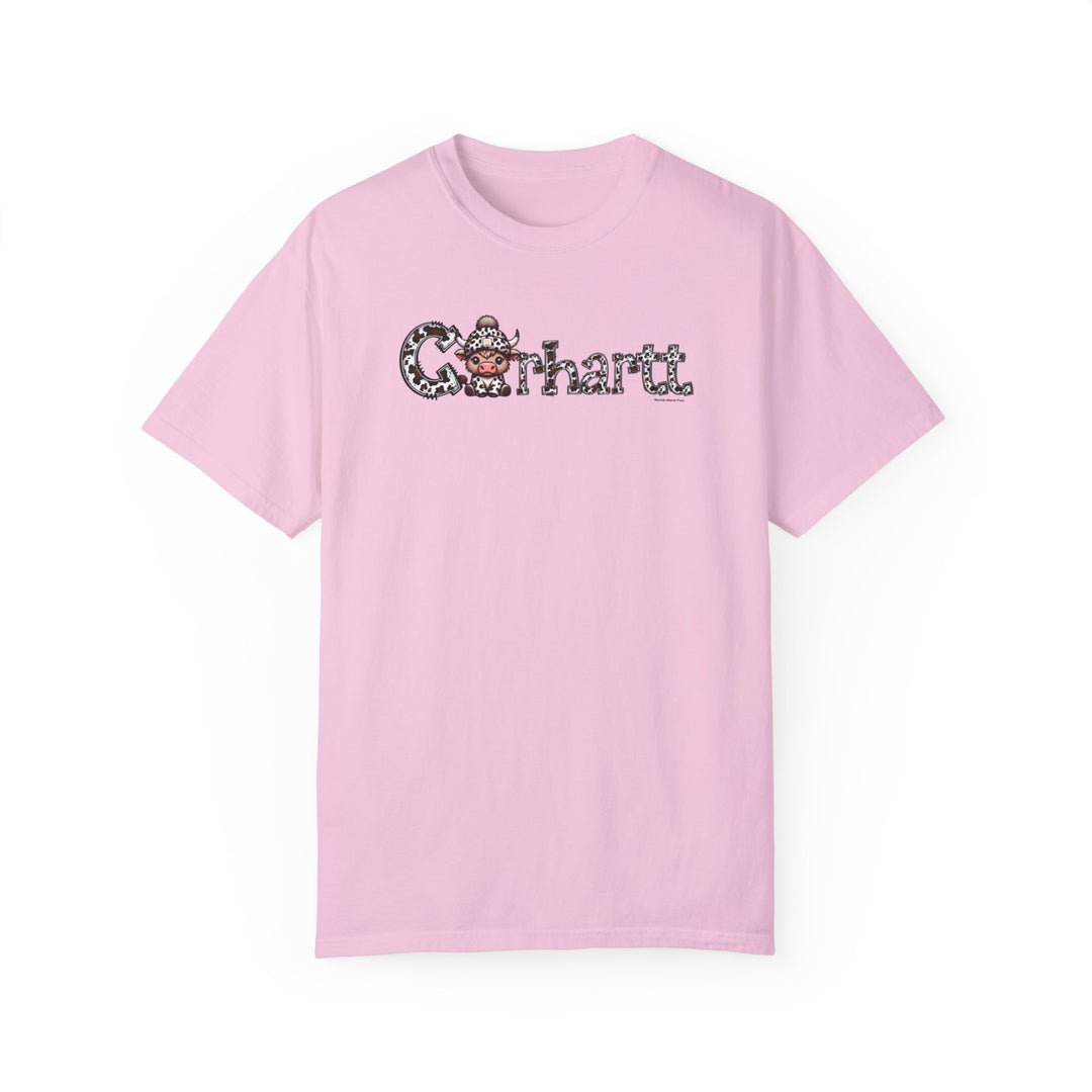 A pink Cowhartt Cow Tee, featuring a cartoon cow design on ring-spun cotton. Garment-dyed for extra coziness, with double-needle stitching for durability and a relaxed fit for daily wear.