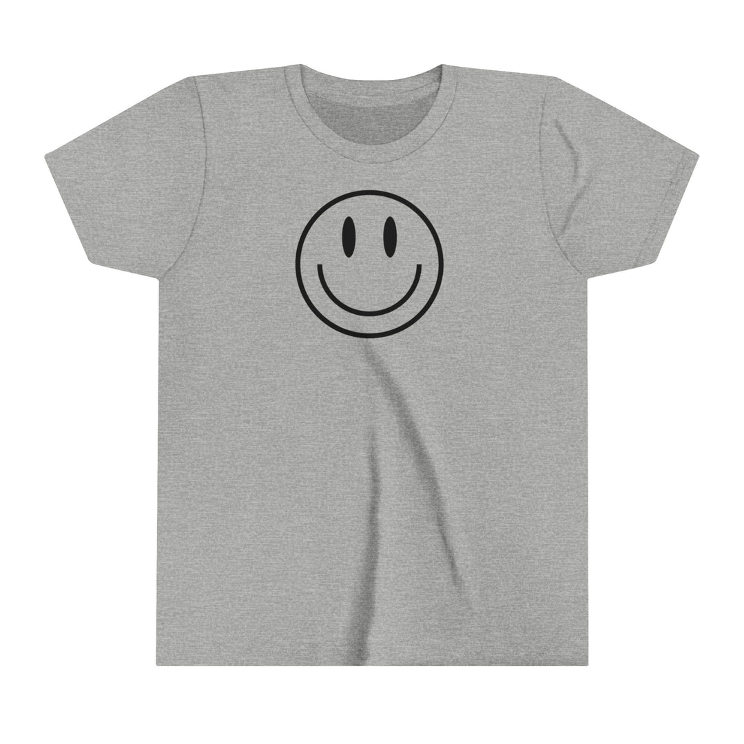 Youth tee featuring a smiley face design on grey fabric. Lightweight and comfortable, made of 100% Airlume combed cotton. Ideal for custom artwork display with a retail fit and tear away label.