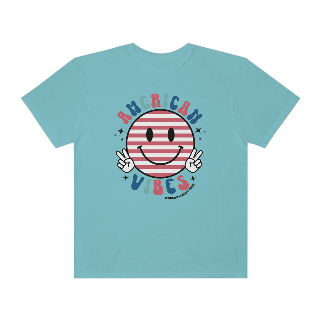 American Vibes Tee: A blue t-shirt featuring a smiley face and peace sign design. 100% ring-spun cotton, garment-dyed for extra coziness. Relaxed fit with double-needle stitching for durability.