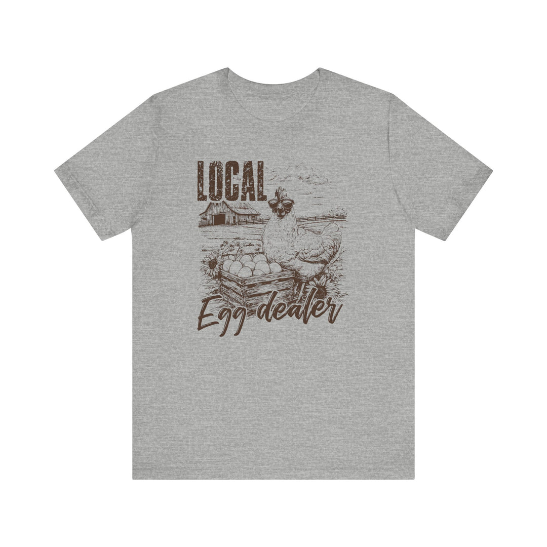 Local Egg Dealer Tee: Classic unisex jersey short sleeve tee with ribbed knit collars, tapered shoulders, and dual side seams, offering comfort and style for casual wear.