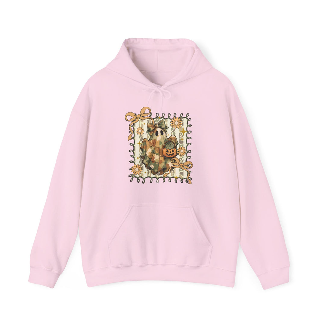 Quilted Ghost Hoodie with whimsical Halloween print, featuring a ghost with jack-o’-lantern, framed by vines and flowers, on a light-pink background.